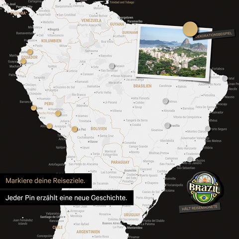 Detail of a magnetic world map as a black and white magnetic board showing South America with a pinned photo as well as travel and vacation magnets