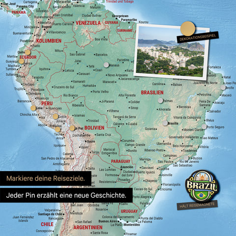 Detail of a magnetic physical world map as a magnetic board in multicolor terra showing South America with a pinned photo as well as travel and vacation magnets