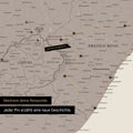 South Africa map in warm gray color (brown-gray) with pins and string marking travel destinations and the travel route in Lesotho and KwaZulu-Natal.