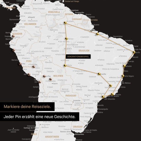 Detail of a world map as a Push Pin Map in black and white showing a section of South America, where pins mark visited travel destinations connected by a colorful thread