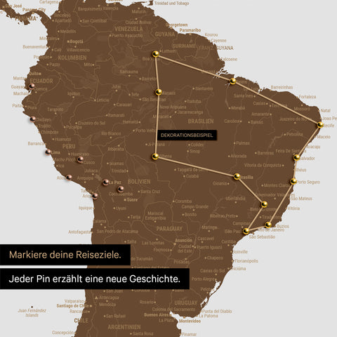 Detail of a push pin world map in Brown with pins, showing a mapped out travel route in South America through the countries of Brazil, Peru and Ecuador
