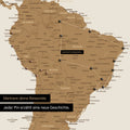 Detail of a push pin world map in Bronze with pins, showing a mapped out travel route in South America through the countries of Brazil, Peru and Ecuador