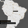 Detail of a push pin world map in Darkgray with pins, showing a mapped out travel route in South America through the countries of Brazil, Peru and Ecuador