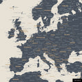 A detailed section of a navy light world map pinboard showing a part of Europe with all countries and capitals.