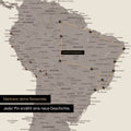 Detail of a push pin world map in Warmgray with pins, showing a mapped out travel route in South America through the countries of Brazil, Peru and Ecuador