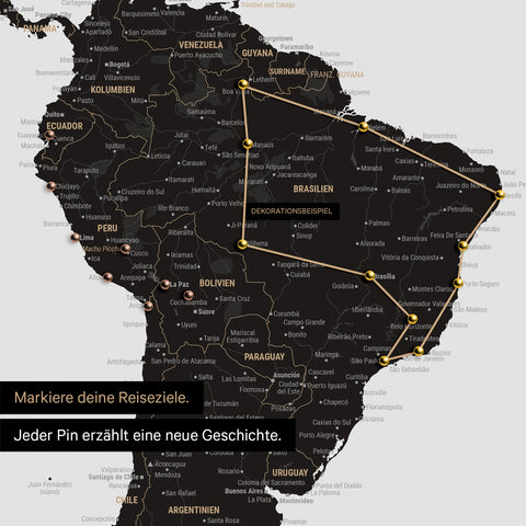Detail of a push pin world map in Light Black with pins, showing a mapped out travel route in South America through the countries of Brazil, Peru and Ecuador