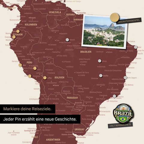 Detail of a magnetic world map as a magnetic board in Bordeaux red showing South America with a pinned photo as well as travel and vacation magnets