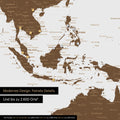 Section of a brown magnetic world map showing a map of Asia, with magnets marking travel destinations