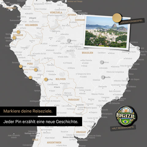 Detail of a magnetic world map as a dark gray magnetic board showing South America with a pinned photo as well as travel and vacation magnets