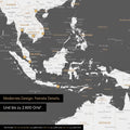 Section of a dark gray magnetic world map showing a map of Asia, with magnets marking travel destinations