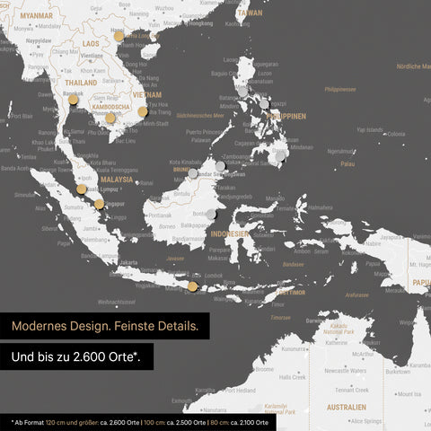 Section of a dark gray magnetic world map showing a map of Asia, with magnets marking travel destinations