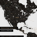Pinning travel destinations on a magnetic world map as a magnet poster in Light Black