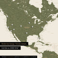 Pinning travel destinations on a magnetic world map as a magnet poster in olive green