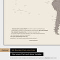 World map in warm gray color (brown-gray) with an embossed quote from Anthony Bourdain, which can be replaced with any other quote during personalization